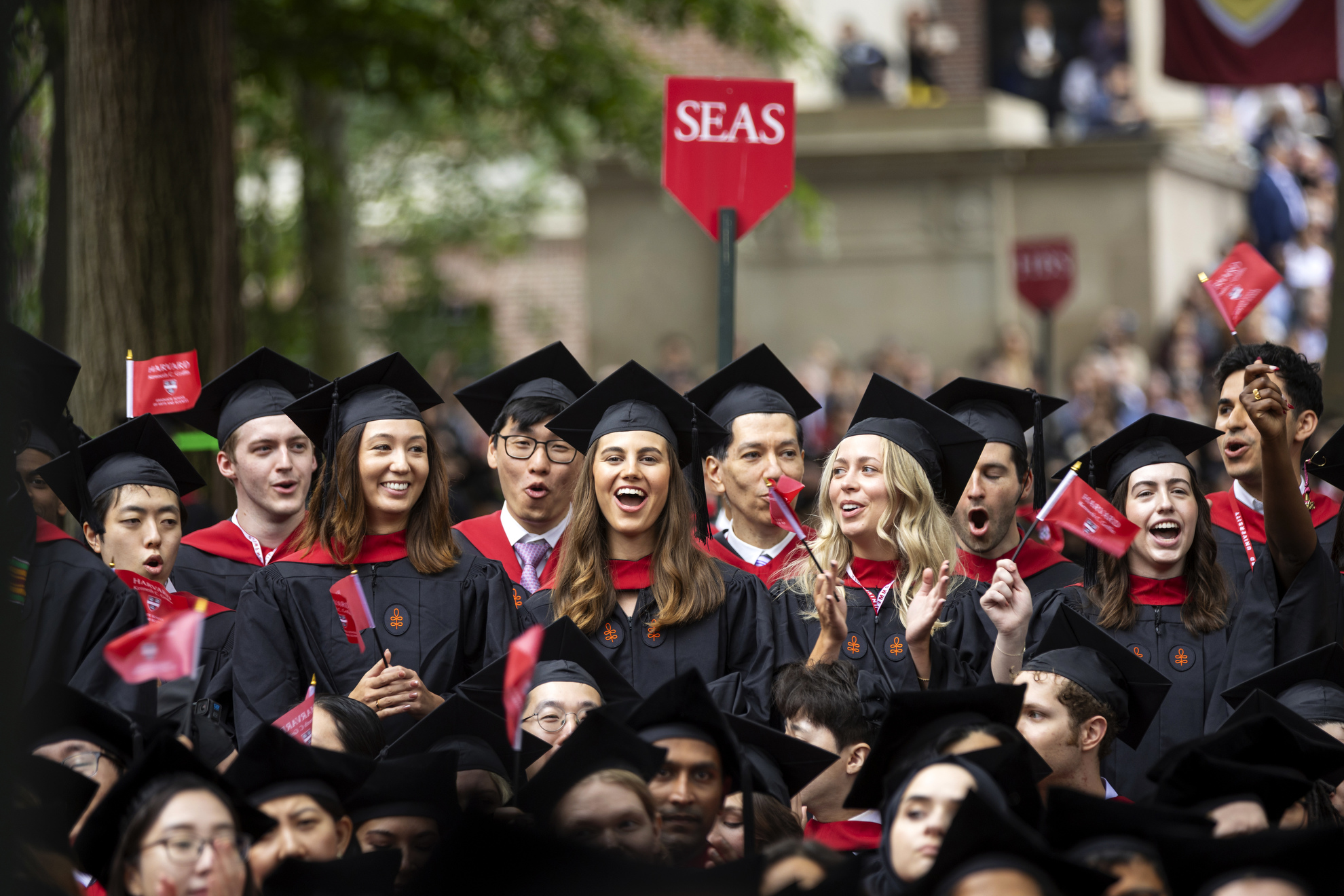 A group of graduates celebrate during the event