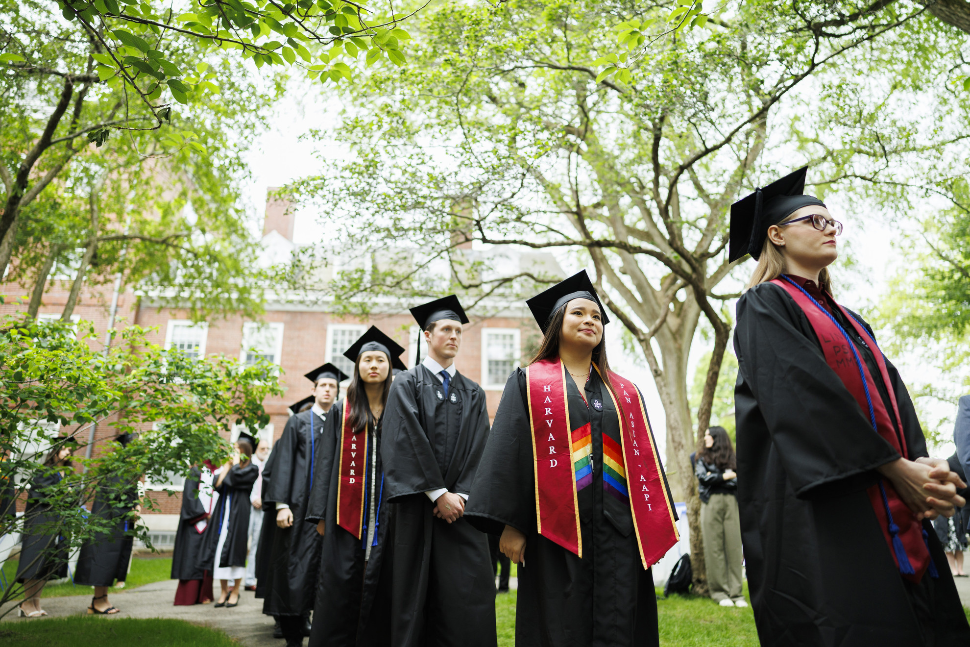 Graduates line up to receive their diplomas.