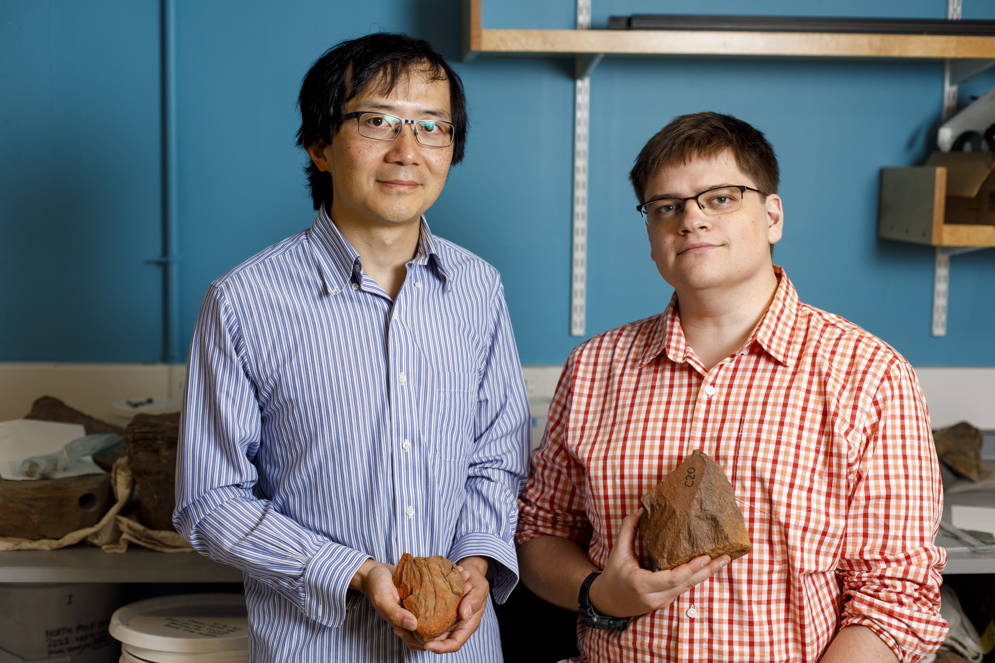 Roger Fu and Alec Brenner show some of the rocks they discovered in Australia.