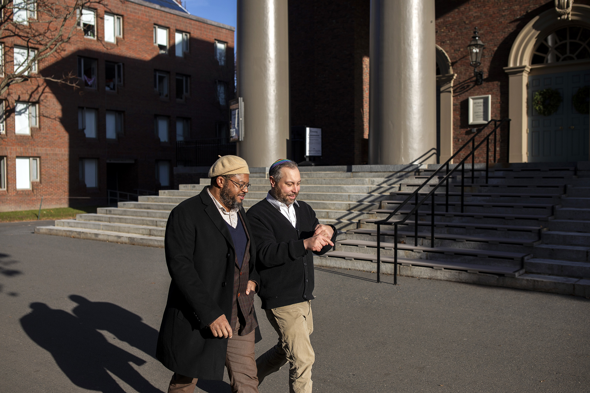 Imam Khalil Abdur-Rashid and Rabbi Getzel Davis walking in Harvard Yard.