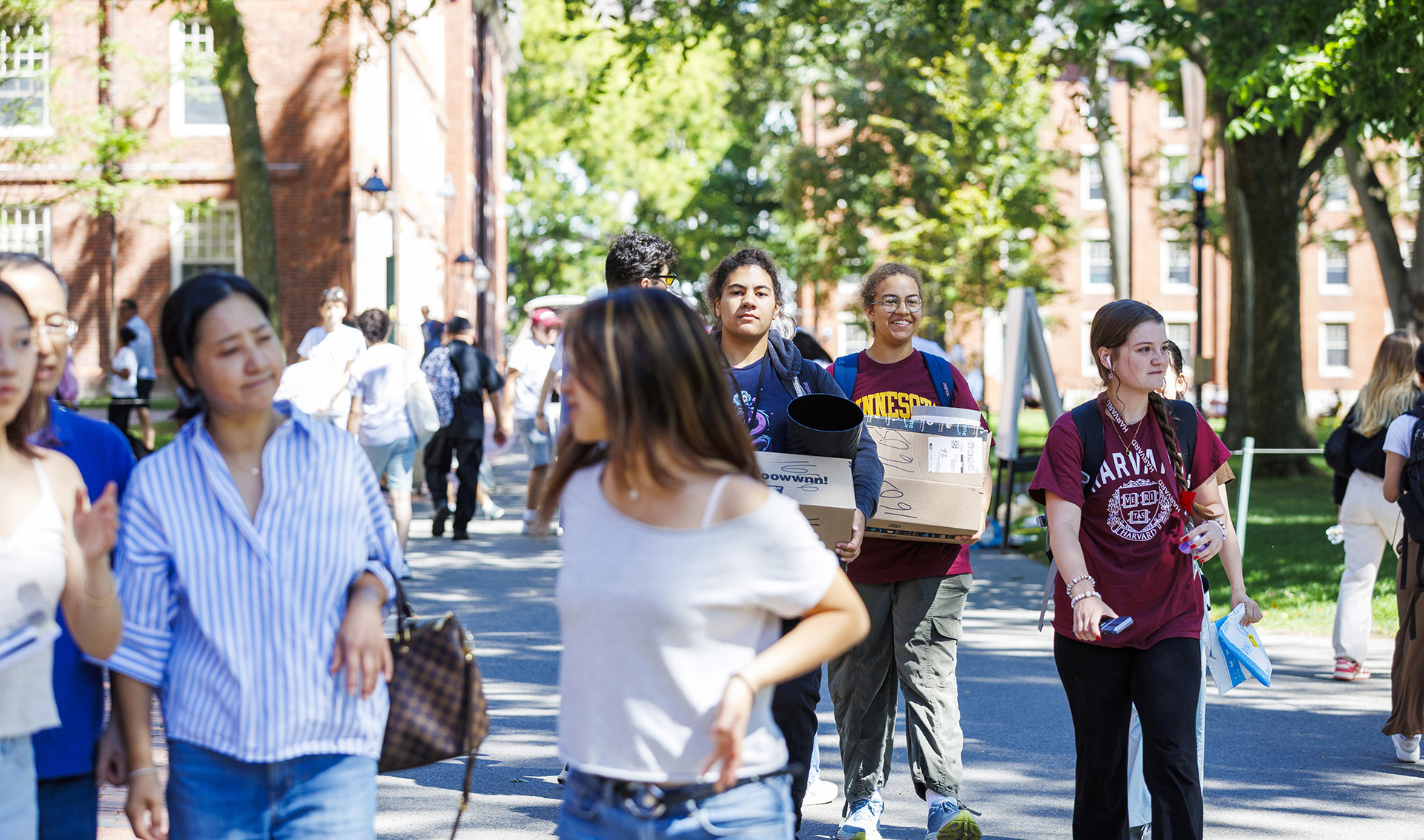 First-year students and their families in Harvard Yard during move-in day.