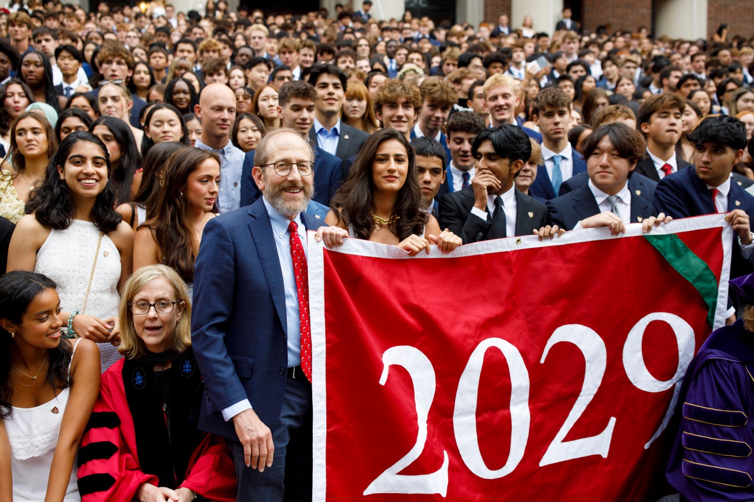 President Garber oins students for class photo.