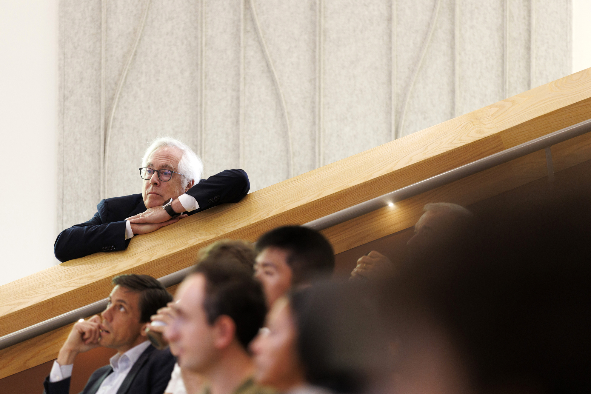 Louis Menand (pictured) listens to his fellow professors give introductory remarks.