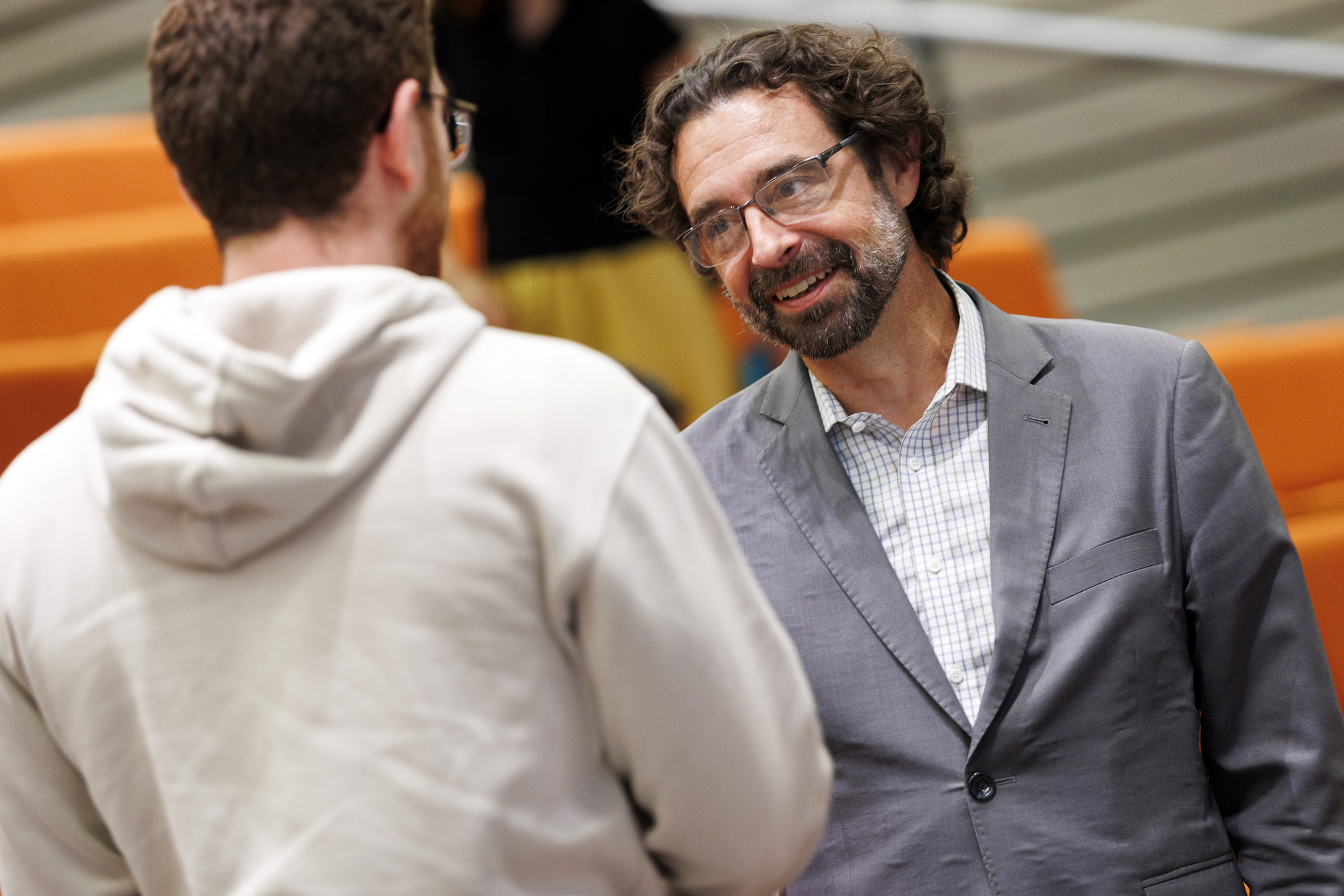 Jason Ur (right) speaks to students following class.