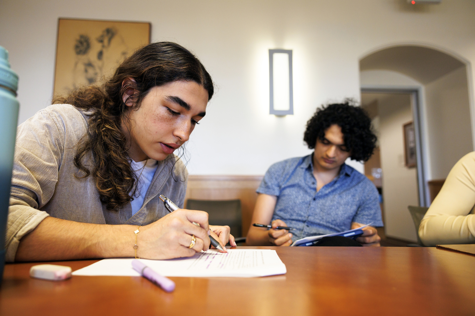 Akram Tahar Chaouch ’29 working on a worksheet during class.