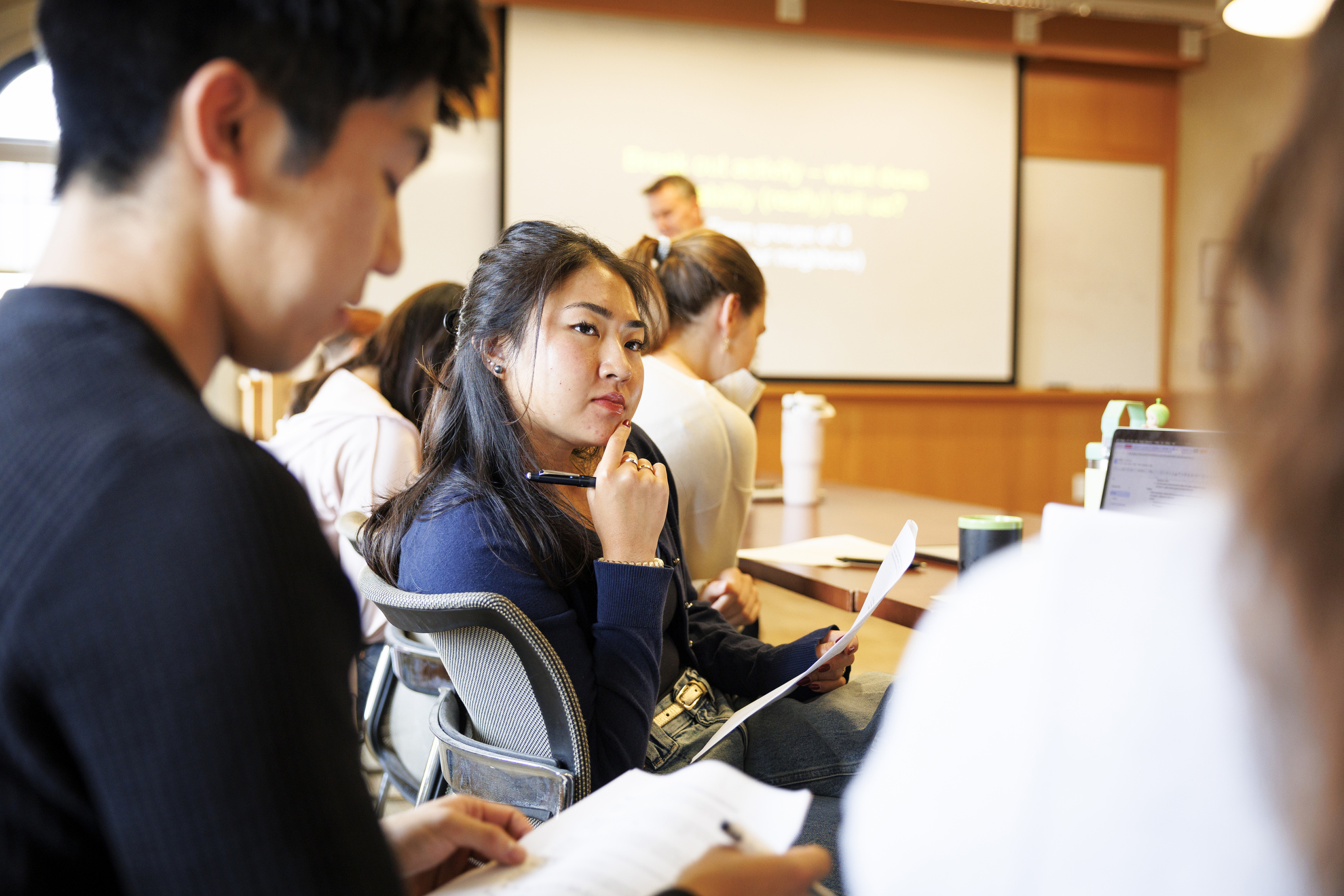 Ally Ah Cook ’26 working on a worksheet during class.