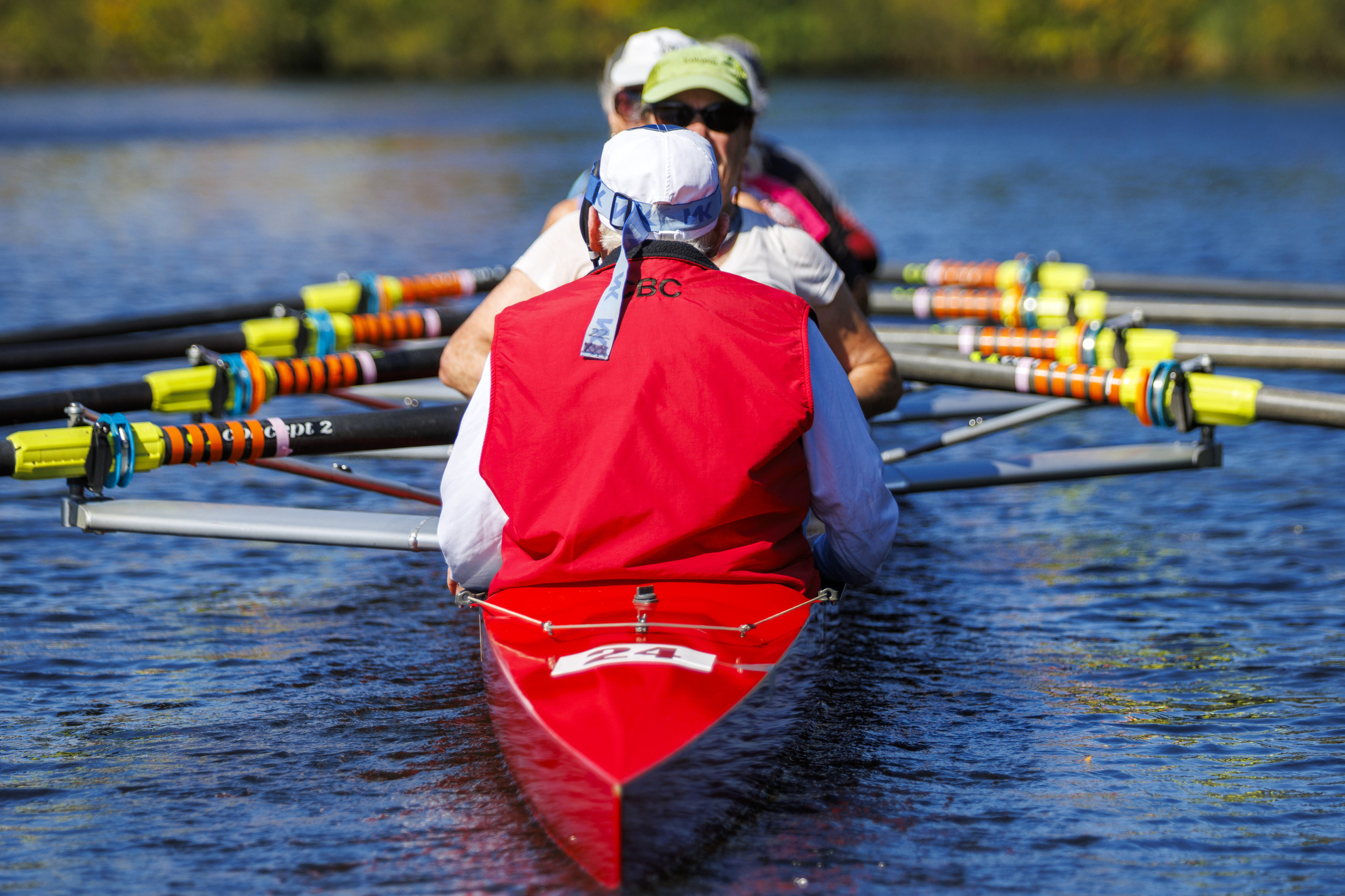 Bill Becklean, the 89-year-old coxswain for the Octo Eight, is pictured from behind on the Charles River.