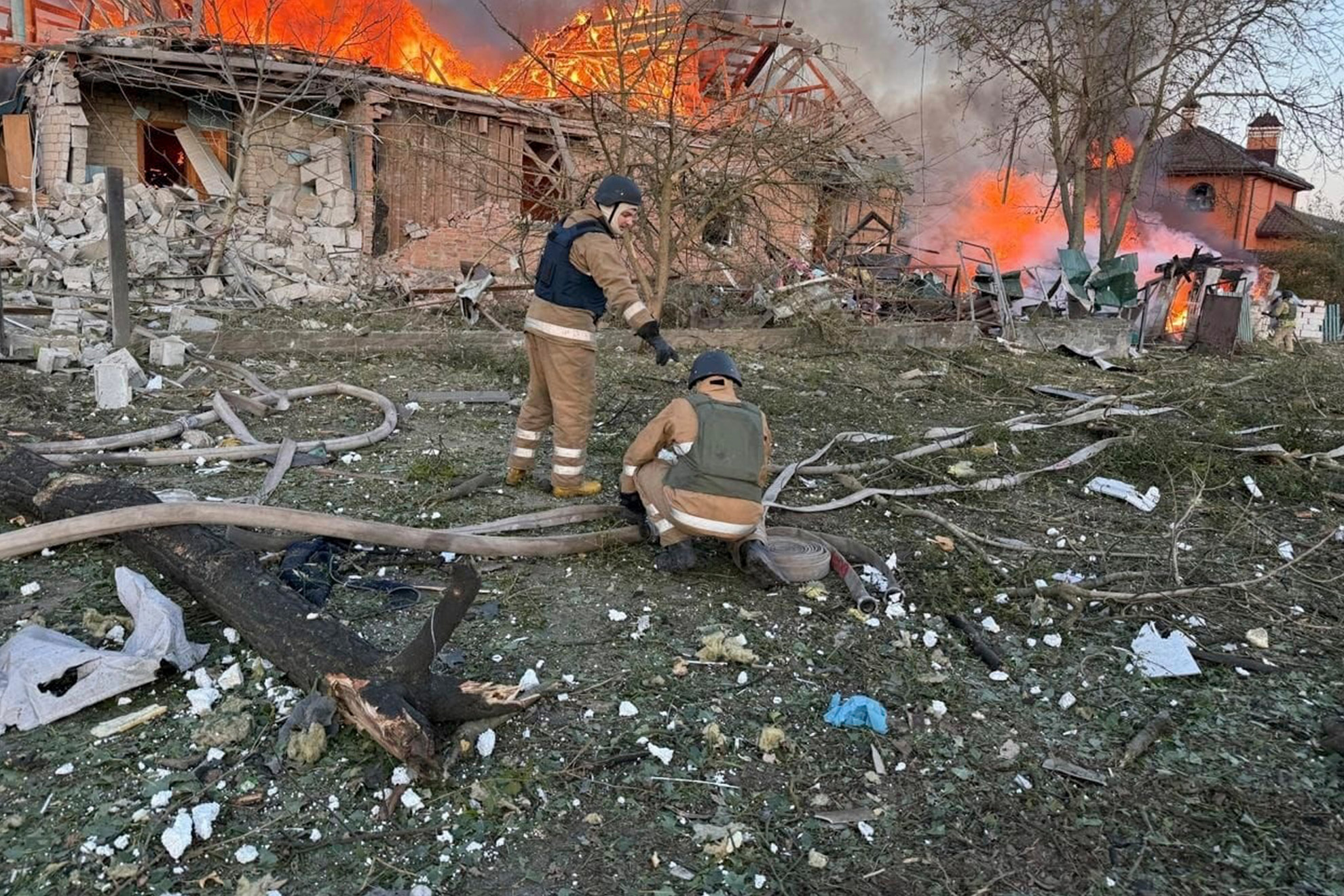 Ukrainian Emergency Services on Wednesday, Sept. 10, 2025, rescue workers put out a fire in a house destroyed by a Russian strike on a residential neighbourhood i