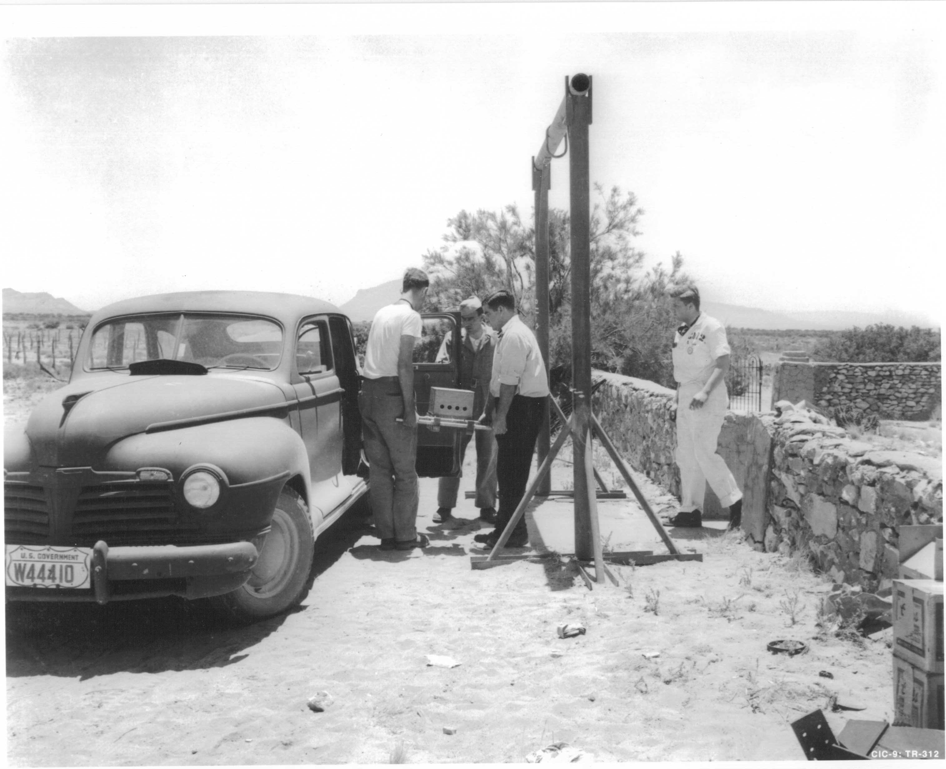 The bomb’s core is loaded into a vehicle at the Army-owned McDonald ranch house, where it was assembled, to be transported to the nearby firing tower at the test site.