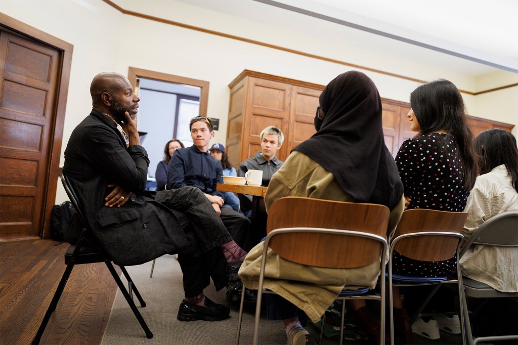 Steve McQueen (left) speaks at ArtsBites, an undergraduate luncheon and discussion series at the Office for the Arts.