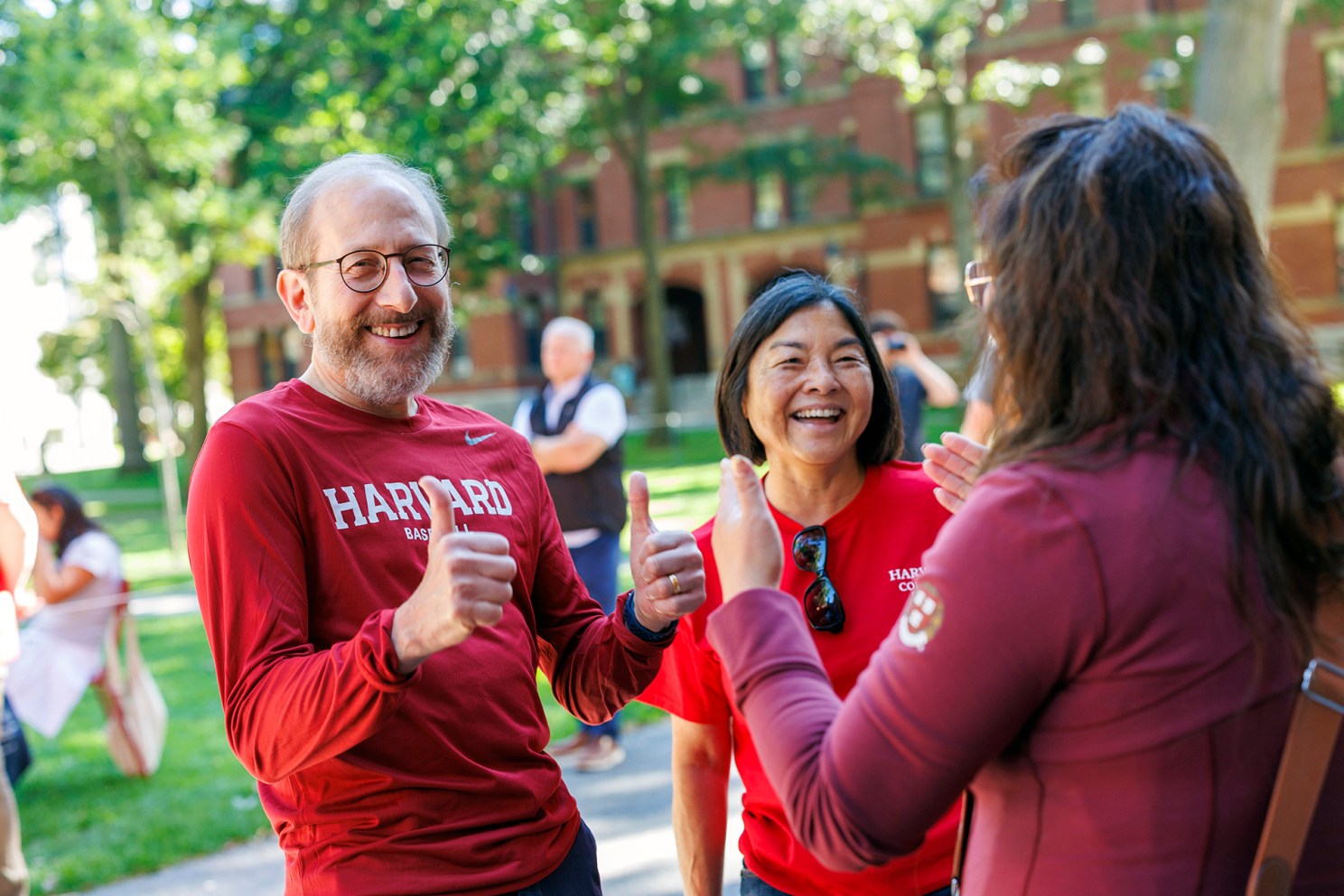 Alan Garber and wife Anne Yahanda greet first-year students during 2025 Harvard move-In day.