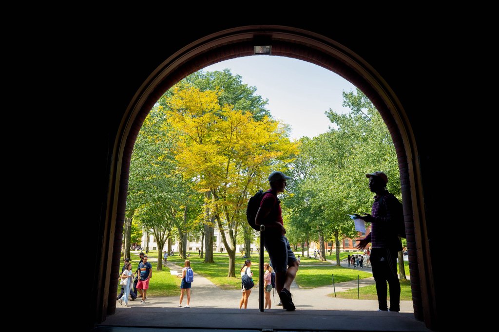 Students talking in Harvard Yard.