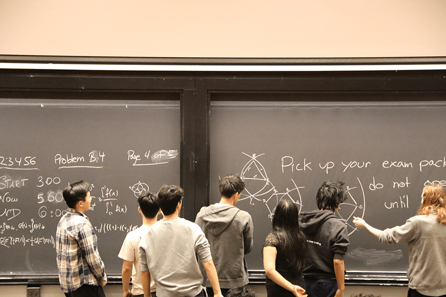 Students in front of the chalkboard