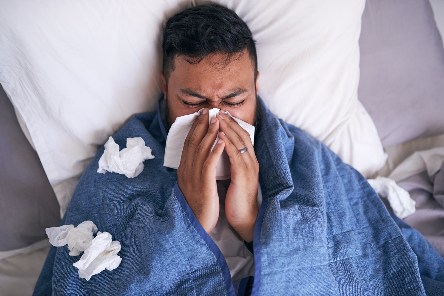man sick in bed