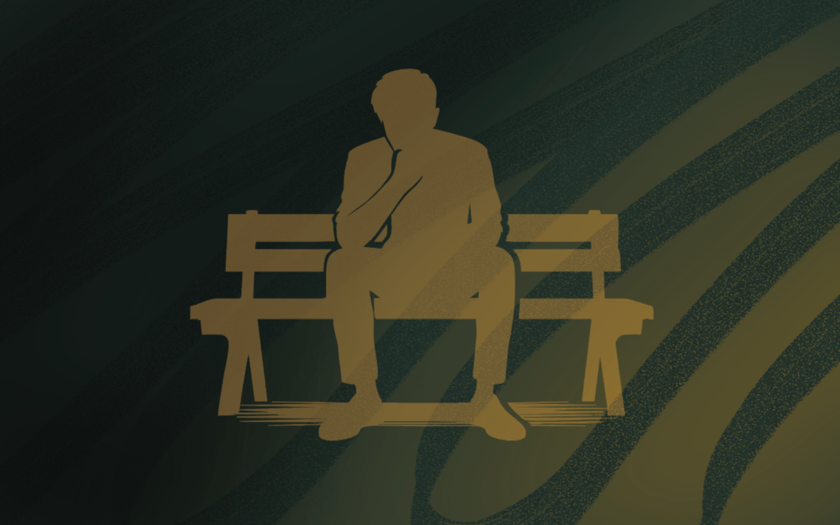 person sitting on bench alone