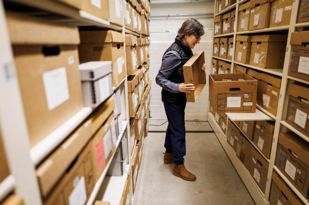 Joanne Donovan shows a storage area where VHS tapes are kept at Schlesinger Library.