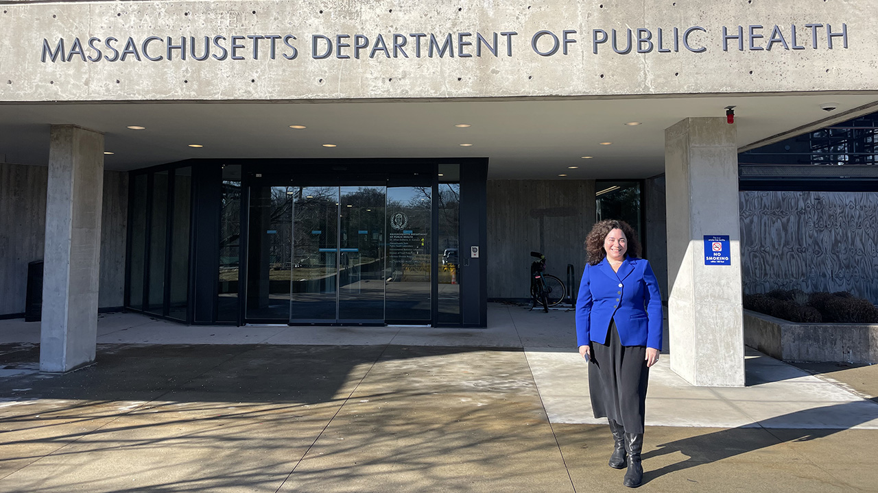 Ingrid Bassett standing in front of a building.