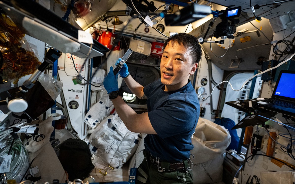 NASA astronaut and Expedition 73 Flight Engineer Jonny Kim waves for a portrait.