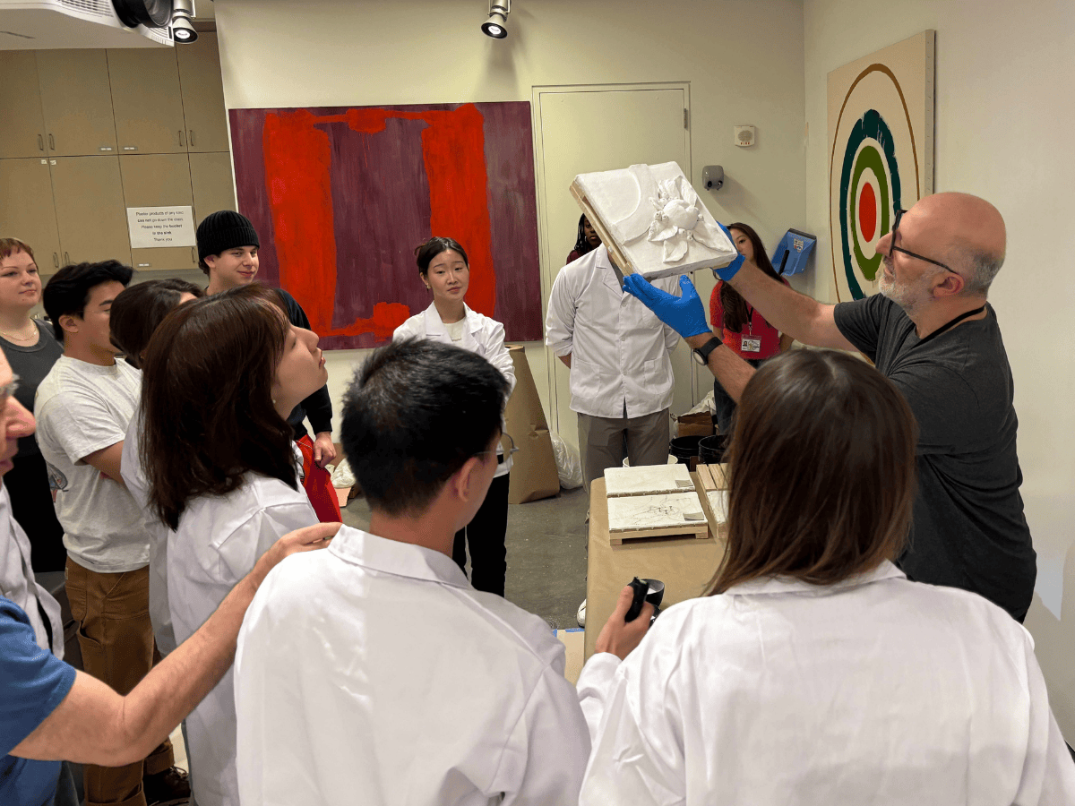 Alberto Felici showing student the final product