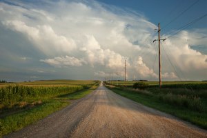 Rural road with dramatic clouds.